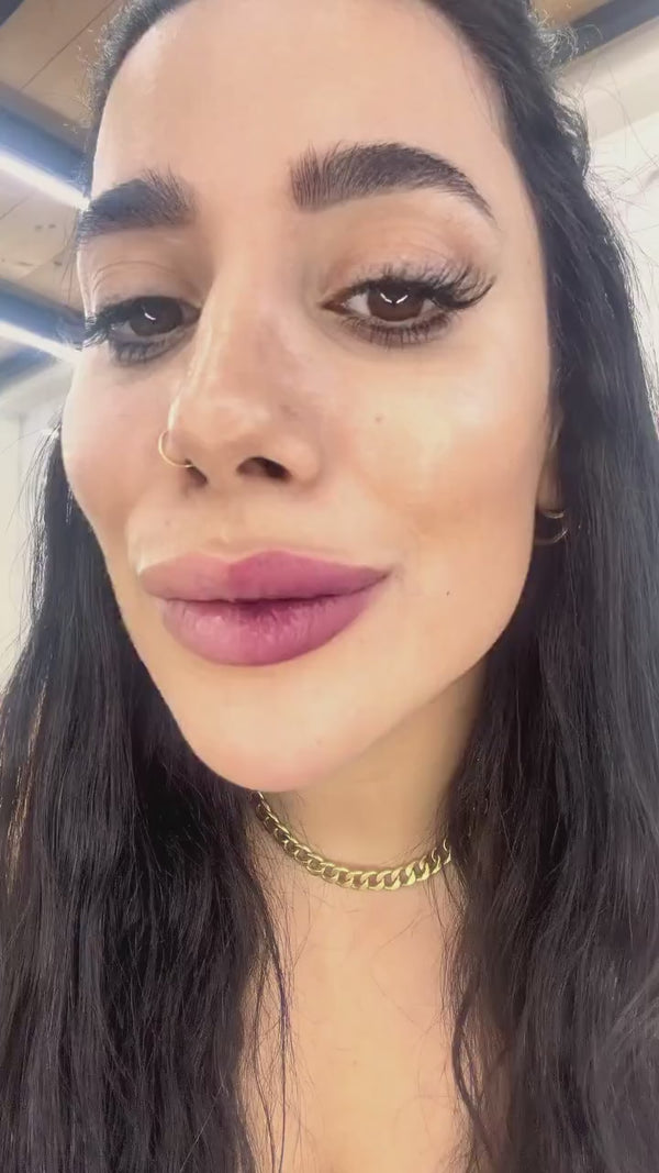 Creator applying and peeling the Trop Lip Stain Masque, video 1